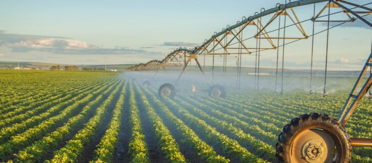 Farmer protecting CIS crops from pests and diseases.